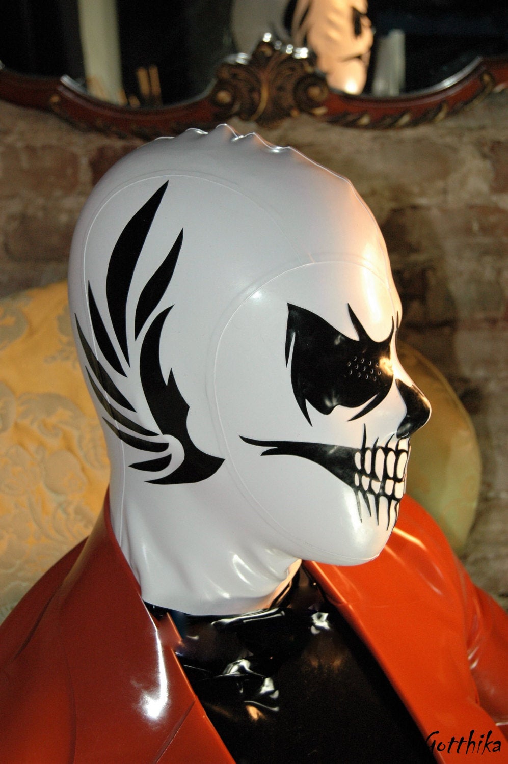 Latex hood grim reaper with perforated eyes, nose and mouth. Optional side wings details.