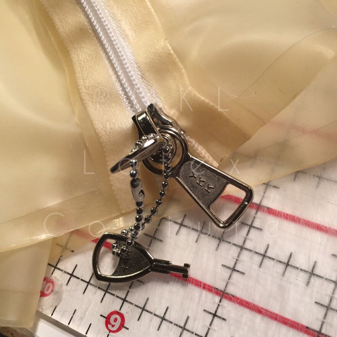 Locking zipper for latex hood